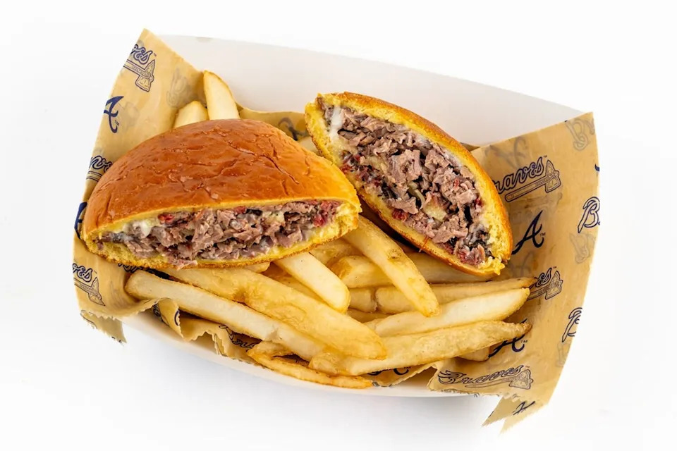 The Baffle (Near Section 113, 1871 Grill): Slow-smoked brisket smothered in rich truffle cheese sauce, piled onto a crispy golden pocket and finished with savory seasoning.