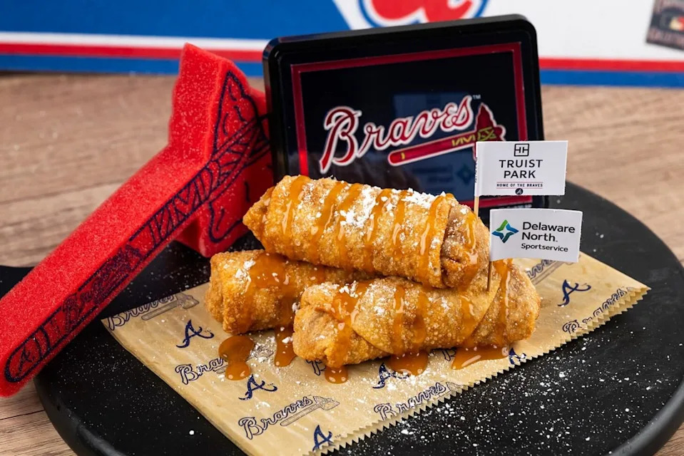 Peach Dingers (Sections 138, 320, Coop’s Championship Chicken): Crispy egg rolls filled with warm cinnamon-spiced peach cobbler and caramel sauce.