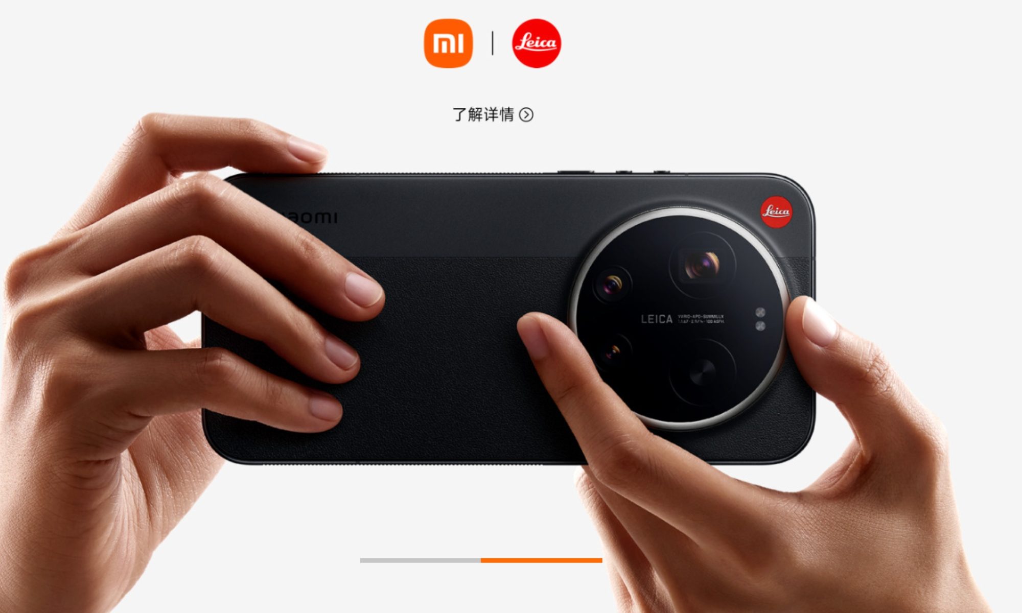 Picture of the Xiaomi 17 Ultra with a hand around the rotating zoom ring.