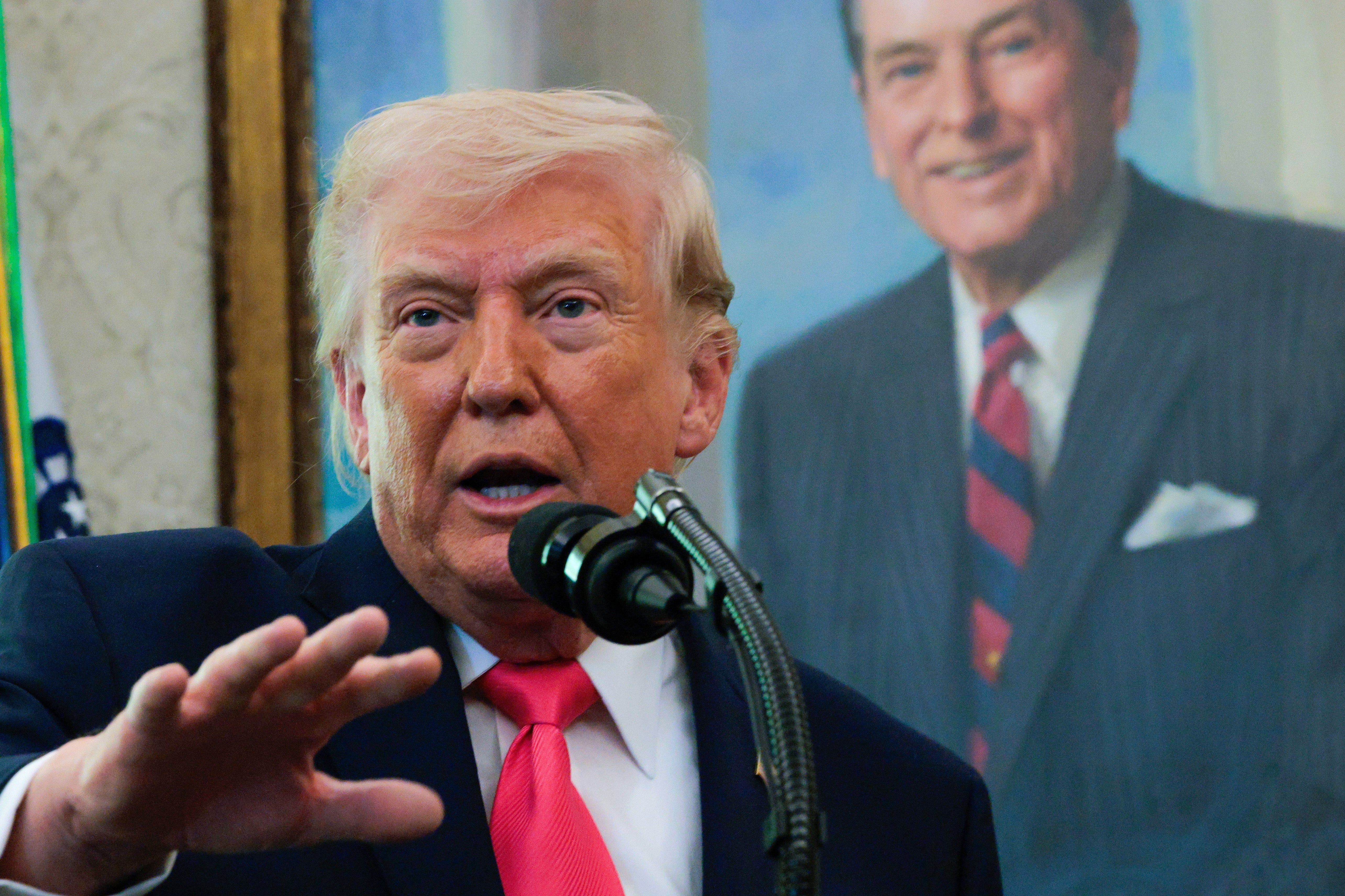 The man himself, taking questions in the Oval Office on March 24, 2026. Reality Reload's Kickstarter page describes the Orange Buddha as one who 
