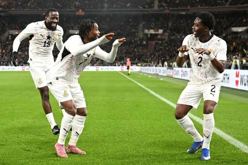 Ghana's Abdul Fatawu (C) celebrates scoring his side's first goal with teammates Elisha Owusu and Derrick Koehn (R) during the International Friendly soccer match between Germany and Ghana at MHP Arena. Marijan Murat/dpa