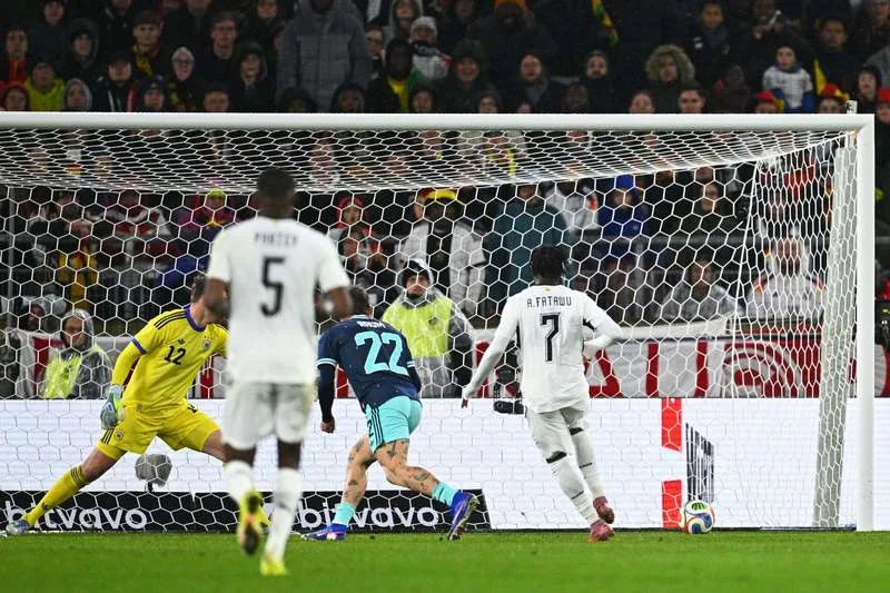 Ghana's Abdul Fatawu (R) scores his side's first goal during the International Friendly soccer match between Germany and Ghana at MHP Arena. Tom Weller/dpa