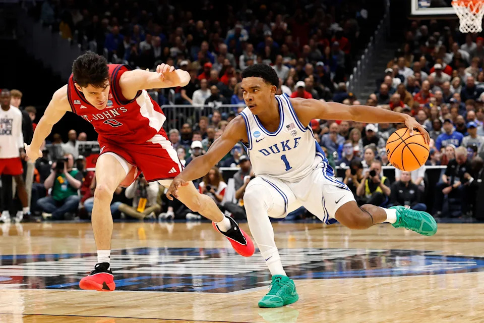 Mar 27, 2026; Washington, DC, USA; Duke Blue Devils guard Caleb Foster (1) dribbles the ball against St. John's Red Storm guard Dylan Darling (0) in the first half during a Sweet Sixteen game of the East Regional of the men's 2026 NCAA Tournament at Capital One Arena. Mandatory Credit: Amber Searls-Imagn Images