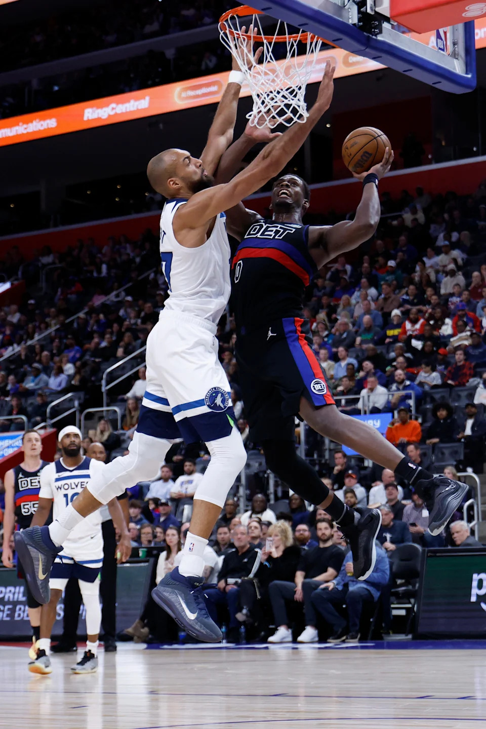 Detroit Pistons center Jalen Duren (0) shoots on Minnesota Timberwolves center Rudy Gobert (27) in the first half at Little Caesars Arena in Detroit on Thursday, April 2, 2026.