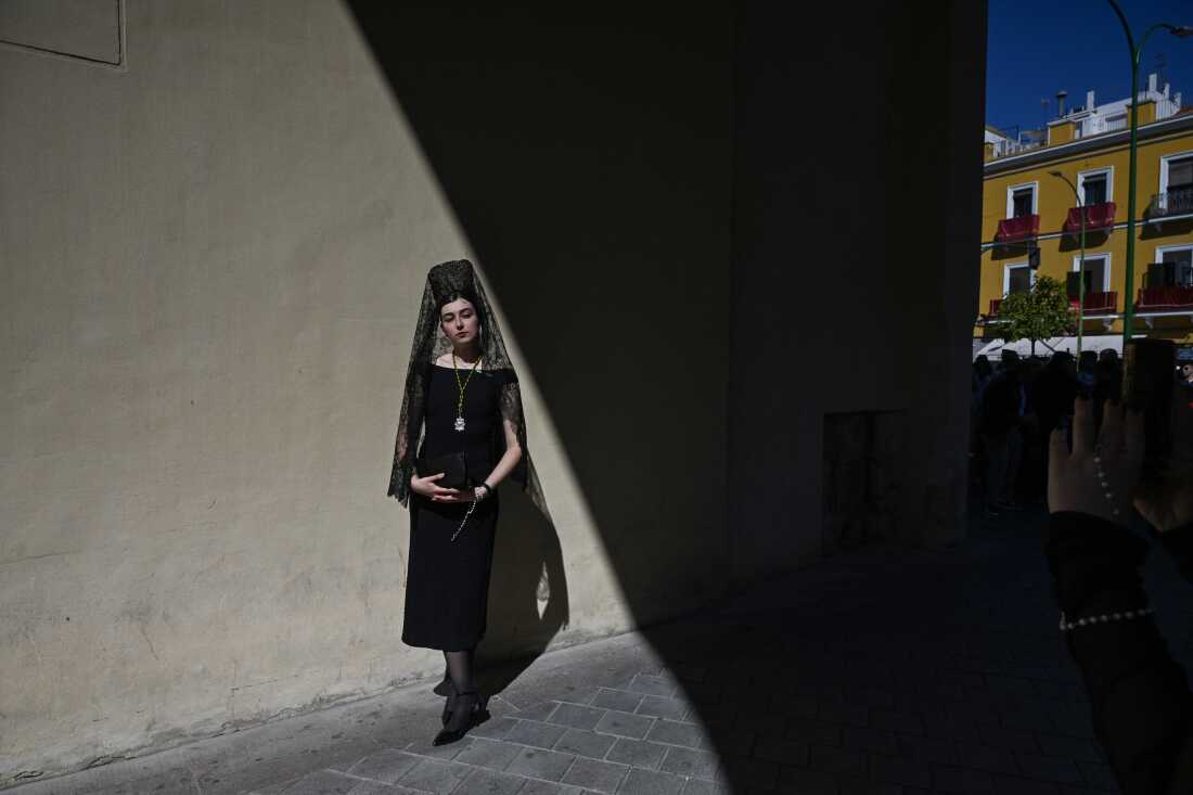 A woman wearing a traditional shawl known as a 