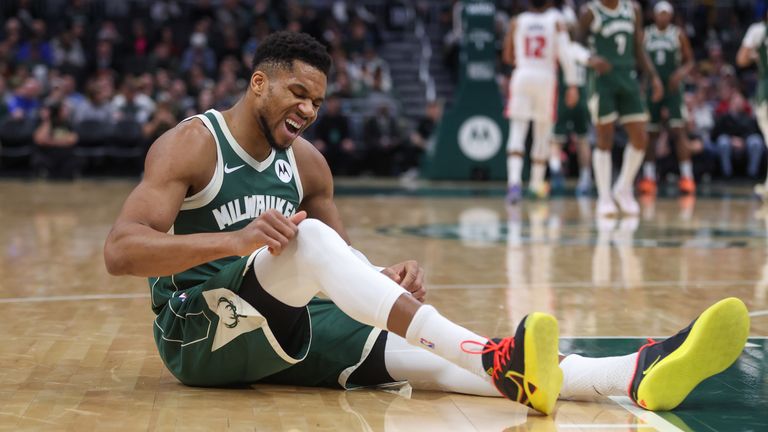 Milwaukee Bucks' Giannis Antetokounmpo reacts after suffering an injury against the Detroit Pistons (AP Photo/Kylie Bridenhagen)