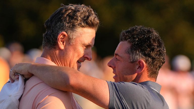 Rory McIlroy, of Northern Ireland, right, hugs Justin Rose, of England, after winning in a playoff after the final round of The Masters
