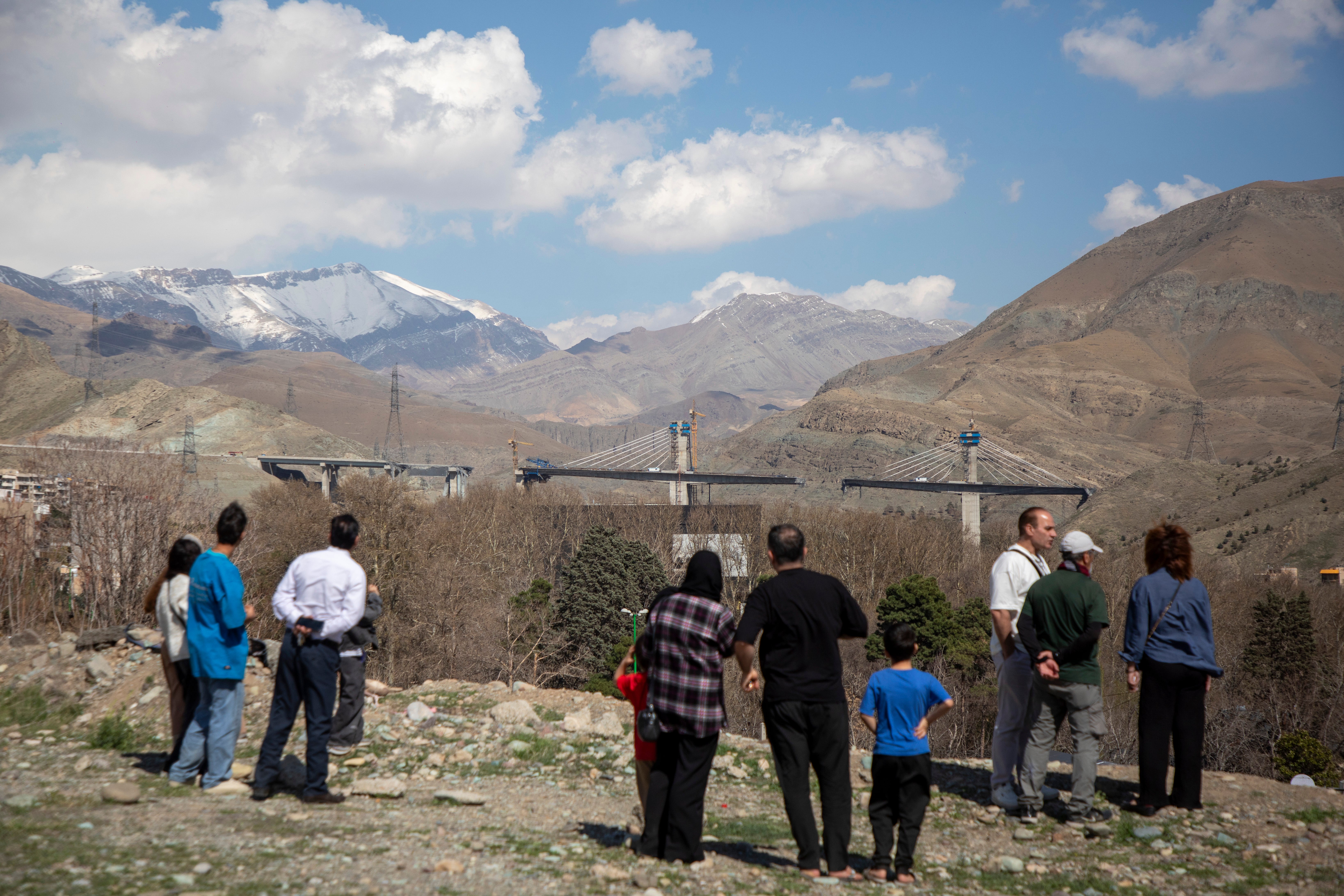 Since the war began, the US has struck more than 13,000 targets in Iran, according to Central Command. People are seen observing a bridge west of Tehran that was damaged by an airstrike on April 2. Iranian officials said eight people were killed and nearly 100 were injured when the bridge was bombed