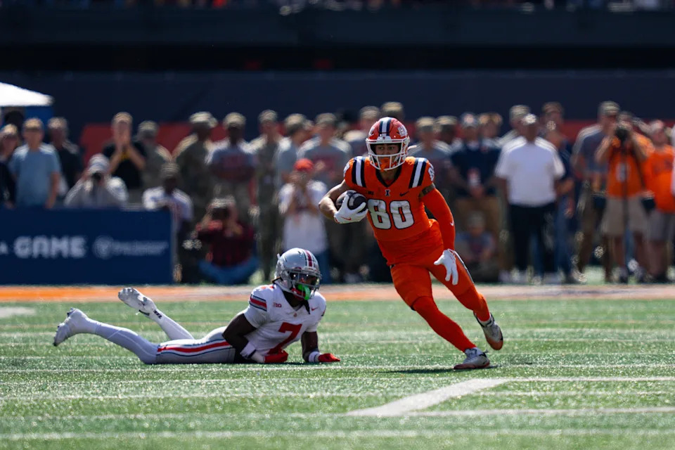 University of Illinois' Hank Beatty carries the ball during the October 11 game between the Ohio State Buckeyes and the Fighting Illini at Memorial Stadium in Champaign.