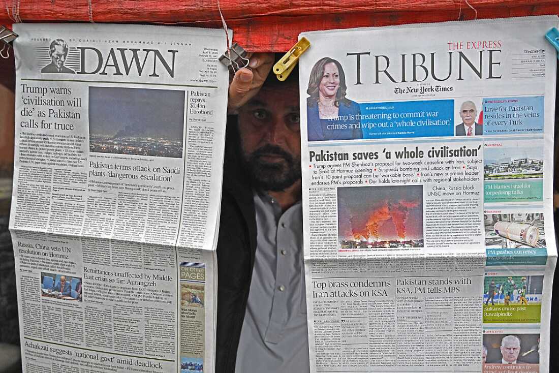 A vendor displays morning newspapers at his roadside stall in Islamabad on April 8, 2026. Pakistan's Prime Minister Shehbaz Sharif said on April 8 that the United States, Iran and their allies had agreed to a ceasefire 