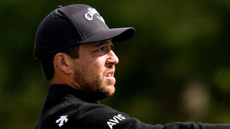 Xander Schauffele checks the wind on the first hole during the first round of the Masters golf tournament at the Augusta National 