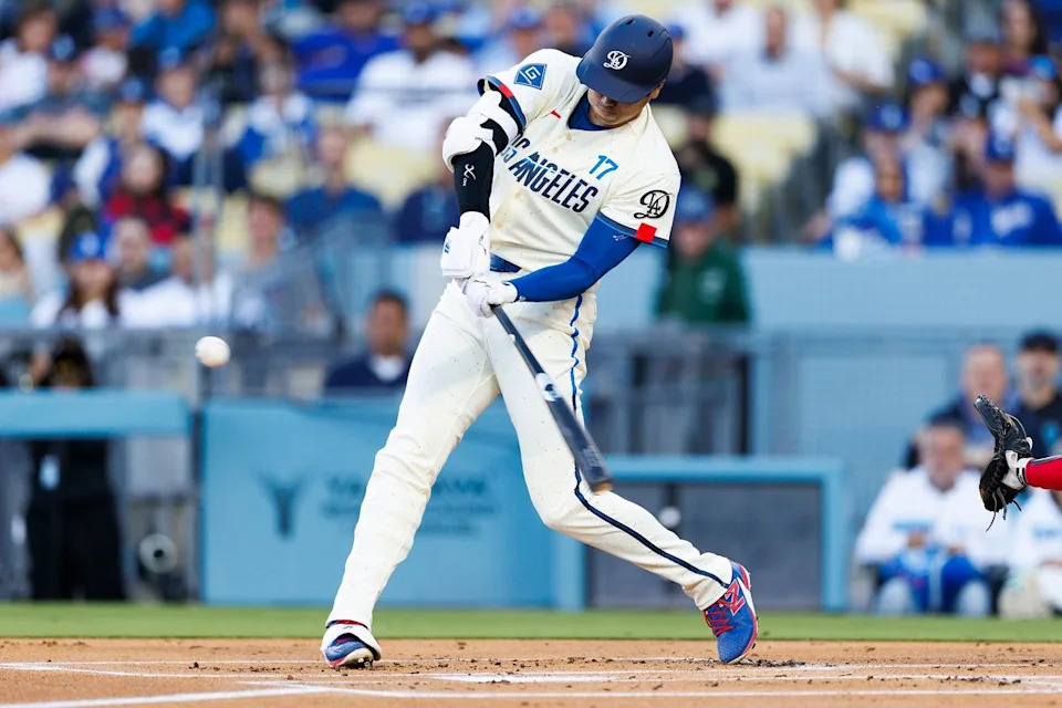 Shohei Ohtani #17 of the Los Angeles Dodgers hits a home run during the game against the Texas Rangers at Dodger Stadium on April 11, 2026 in Los Angeles, California. 