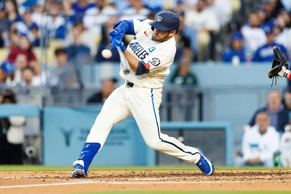 Max Muncy #13 of the Los Angeles Dodgers hits during the game against the Texas Rangers at Dodger Stadium on April 11, 2026 in Los Angeles, California.
