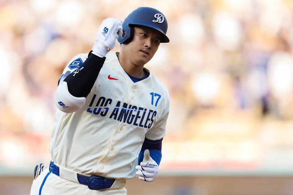 Shohei Ohtani #17 of the Los Angeles Dodgers celebrates his home run during the game against the Texas Rangers at Dodger Stadium on April 11, 2026 in Los Angeles, California. 