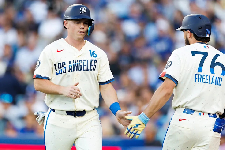 Will Smith #16 of the Los Angeles Dodgers celebrates with Alex Freeland #76 of the Los Angeles Dodgers during the game against the Texas Rangers at Dodger Stadium on April 11, 2026 in Los Angeles, California. 