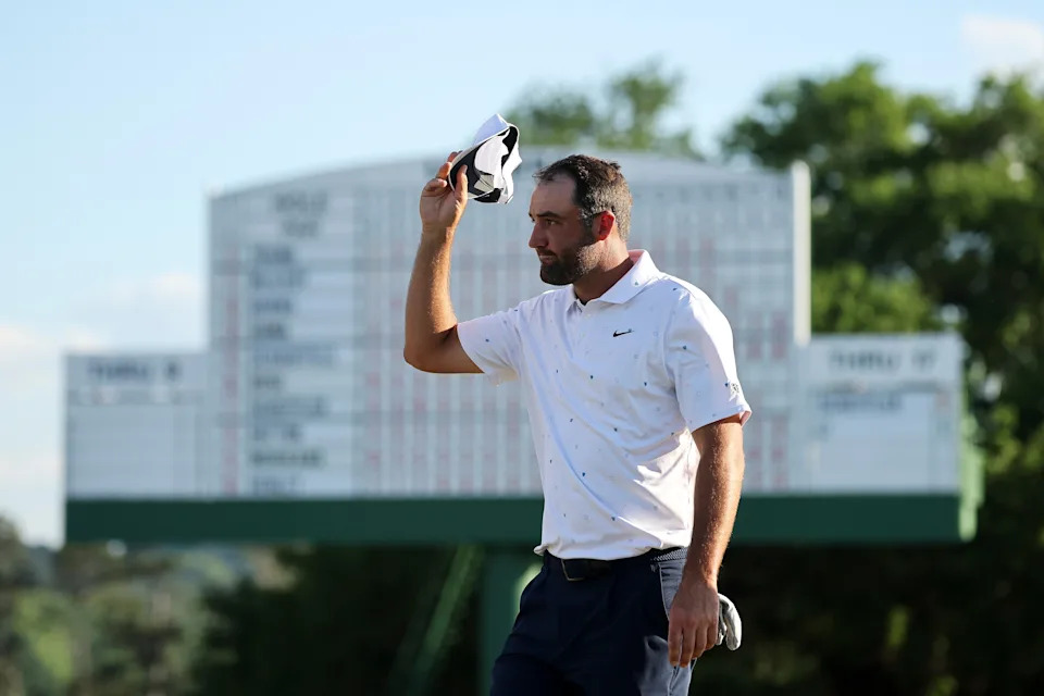 AUGUSTA, GEORGIA - APRIL 12: Scottie Scheffler of the United States acknowledges the crowd on the 18th green during the final round of the 2026 Masters Tournament at Augusta National Golf Club on April 12, 2026 in Augusta, Georgia. (Photo by Hector Vivas/Getty Images)