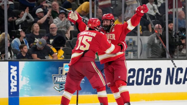 Denver stuns Michigan in 2OT, plays Wisconsin for Frozen Four title | Latest Sports News