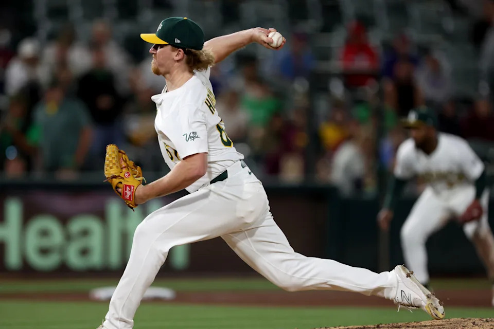 May 24, 2025; West Sacramento, California, USA; Athletics pitcher Grant Holman (67) throws a pitch against the Philadelphia Phillies during the tenth inning at Sutter Health Park. Mandatory Credit: Dennis Lee-Imagn Images