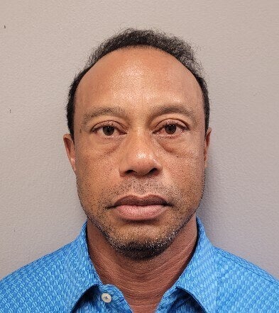 Tiger Woods was arrested and taken to jail on Friday after his car rolled in a crash