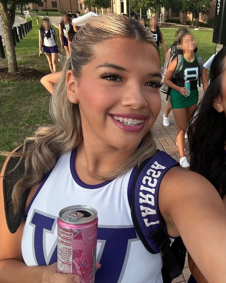 Larissa Nicole Rodriguez holds a can of Alani Nu, an energy drink with 200 mg of caffeine.