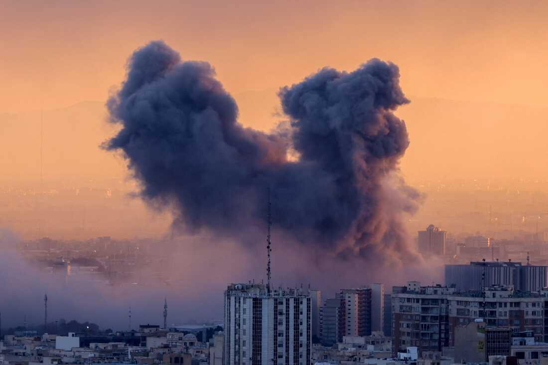 A plume of smoke rises behind tall buildings after a strike on Tehran, Iran on March 3.