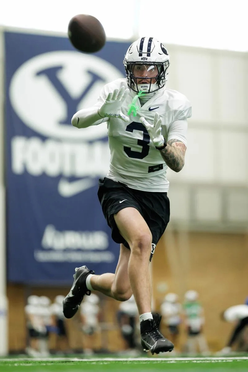 BYU receiver Kyler Kasper prepares to make a catch during spring drills at the indoor practice facility in Provo. | Jaren Wilkey, BYU Photo