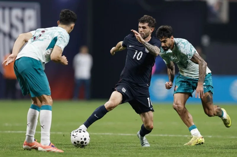 United States Men's National Team forward Christian Pulisic (C) dribbles between Portugal defenders during an international friendly Tuesday at Mercedes-Benz Stadium in Atlanta. Photo by Mike Zarrilli/UPI