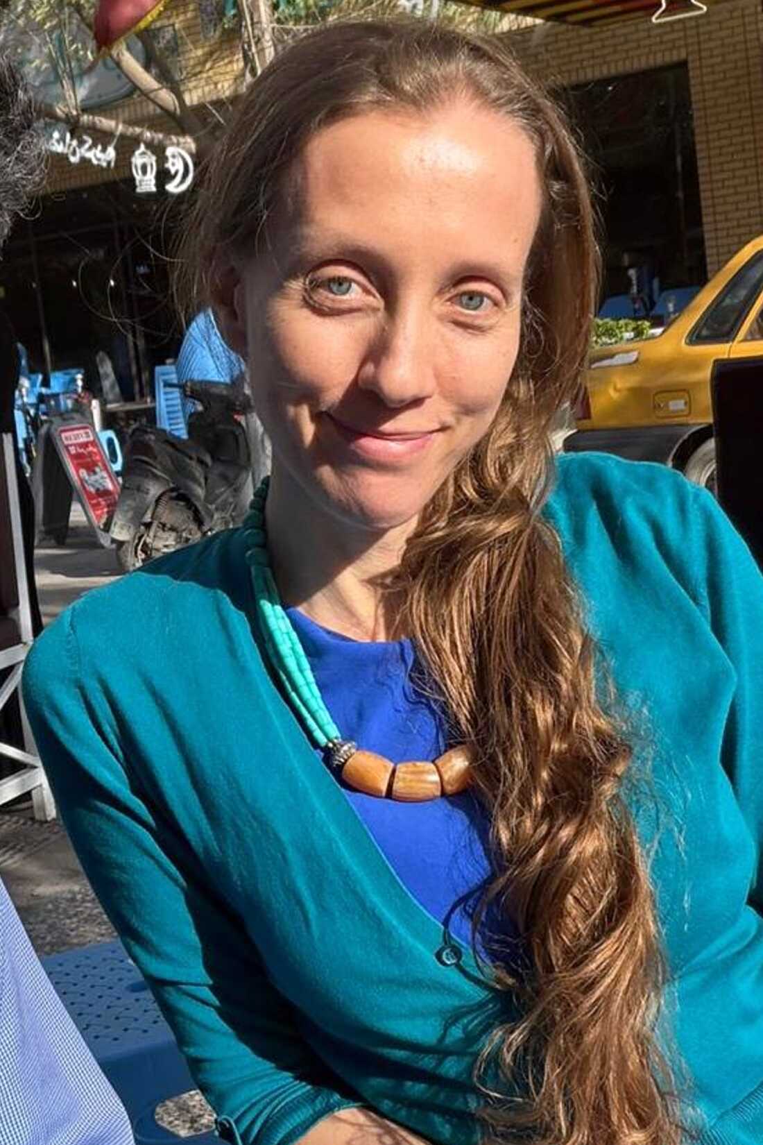 U.S. journalist Shelly Kittleson poses for a cellphone photo in a cafe in Baghdad, Iraq, March 30.