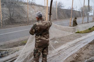 Ukrainian soldiers covering the roads with fishing as a protection from FPV drones attacs in the region of Sumy in the east of Ukraine